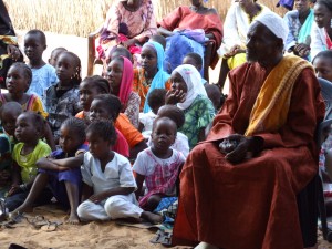 Demba Diawara with girls in his community of Keur Simbara, who will now not go through FGC