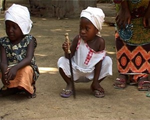 A Sierra Leonean girl holds her ceremonial knife. Five years of age, she is learning the trade of the Soweis so she can support her family. Photo © IRIN