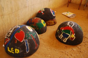 Calabashes painted by the children with images of human rights